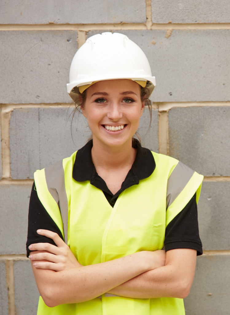 A woman in a hi vis jacket and hard hat